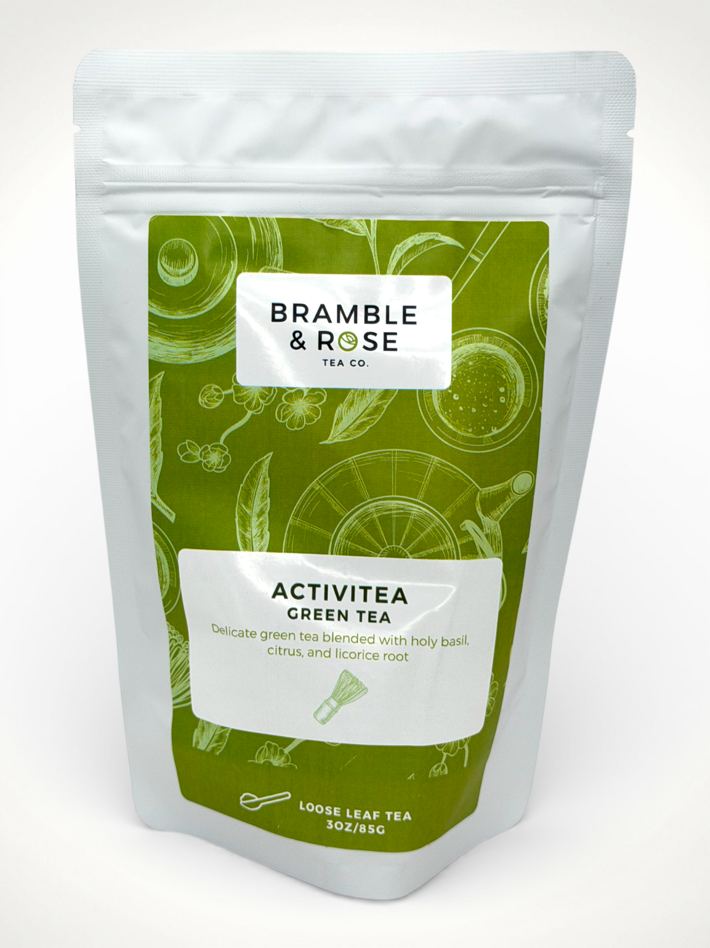 White pouch of Bramble & Rose ActiviTea Green Tea, with a green label design featuring tea illustrations, a white rectangle with product description, and the "Bramble & Rose" logo.