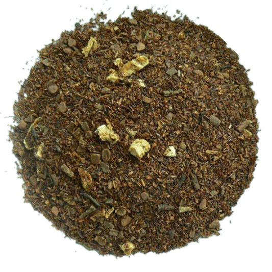 A close-up image of dried rooibos with orange peel, cinnamon bits, and cloves
