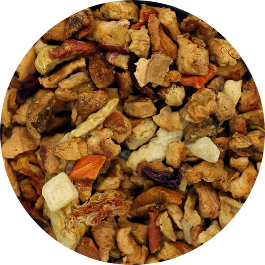 A close-up image of dried pieces of watermelon, honeydew, apple, carrot, and beetroot in a circular frame