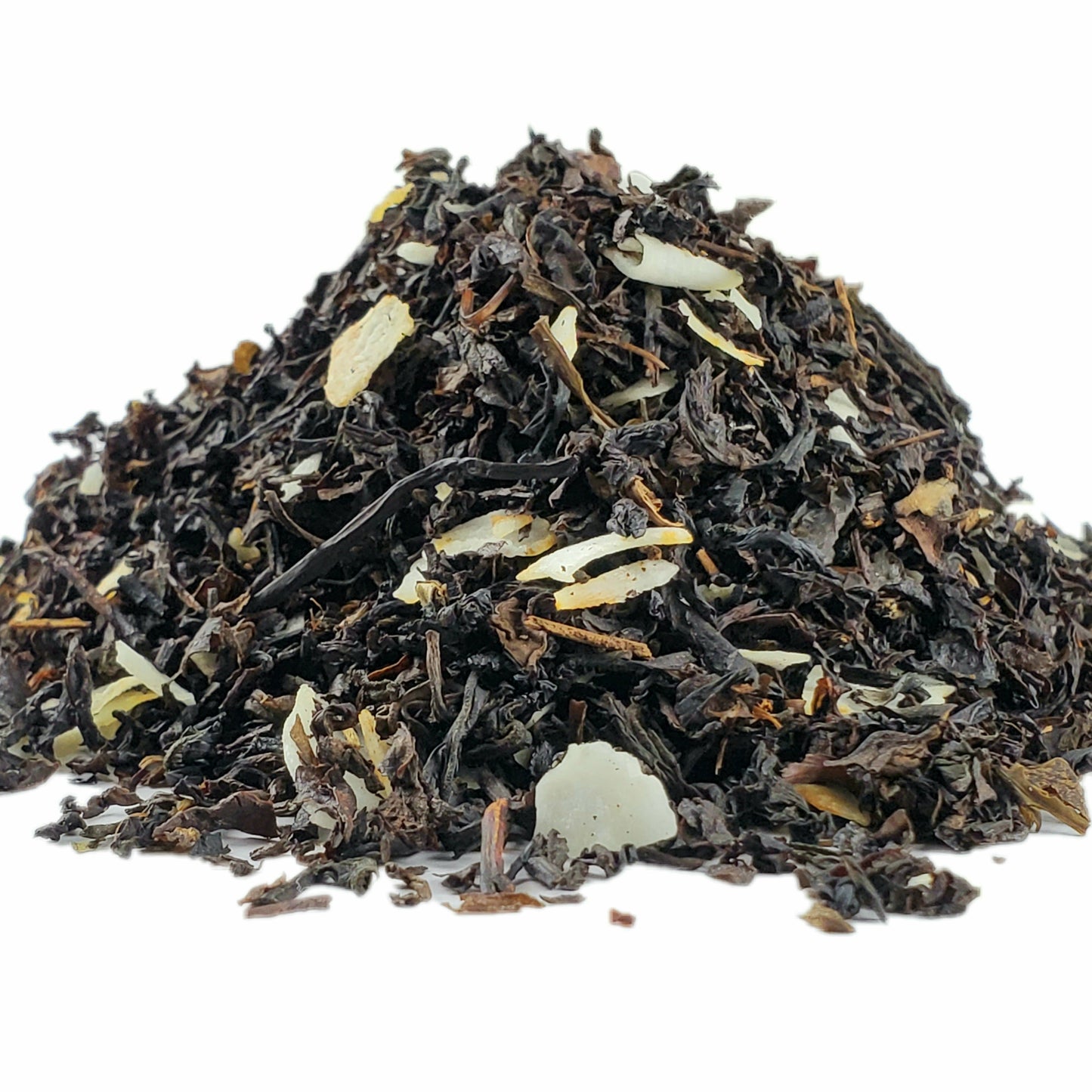 A close-up pile of dried oolong tea leaves and shaved coconut