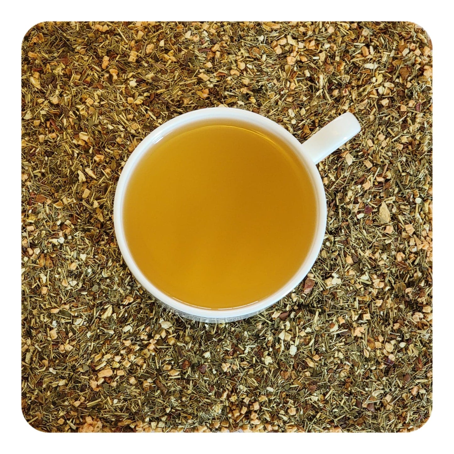 A cup of lemon sorbet tea surrounded by dried Lemon sorbet tea ingredients including lemongrass, lemon peel, blackberry leaf, and apple pieces.