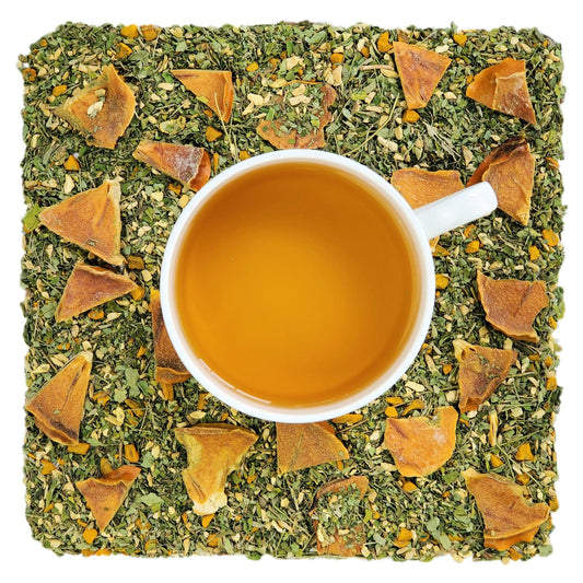 A cup of herbal tea with pieces of persimmon, moringa, and ginger root visible in the background, representing the product 'Organic Persimmon Reflux Relief'.