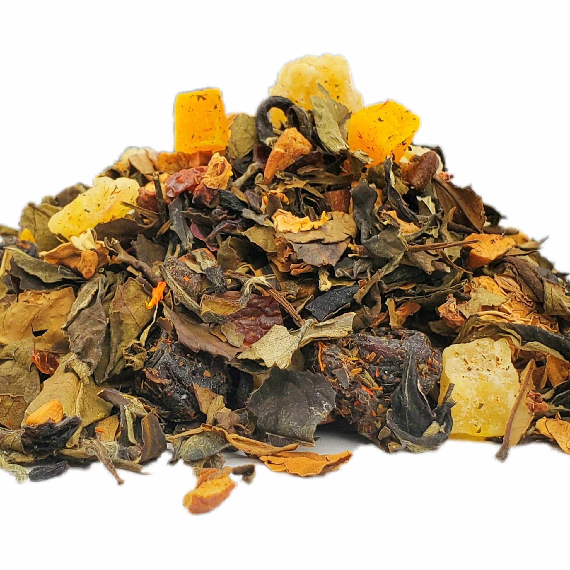 A close-up image of dried white tea leaves, pineapple, apple, cranberry, mango, rosehips, rose petals, and hibiscus.